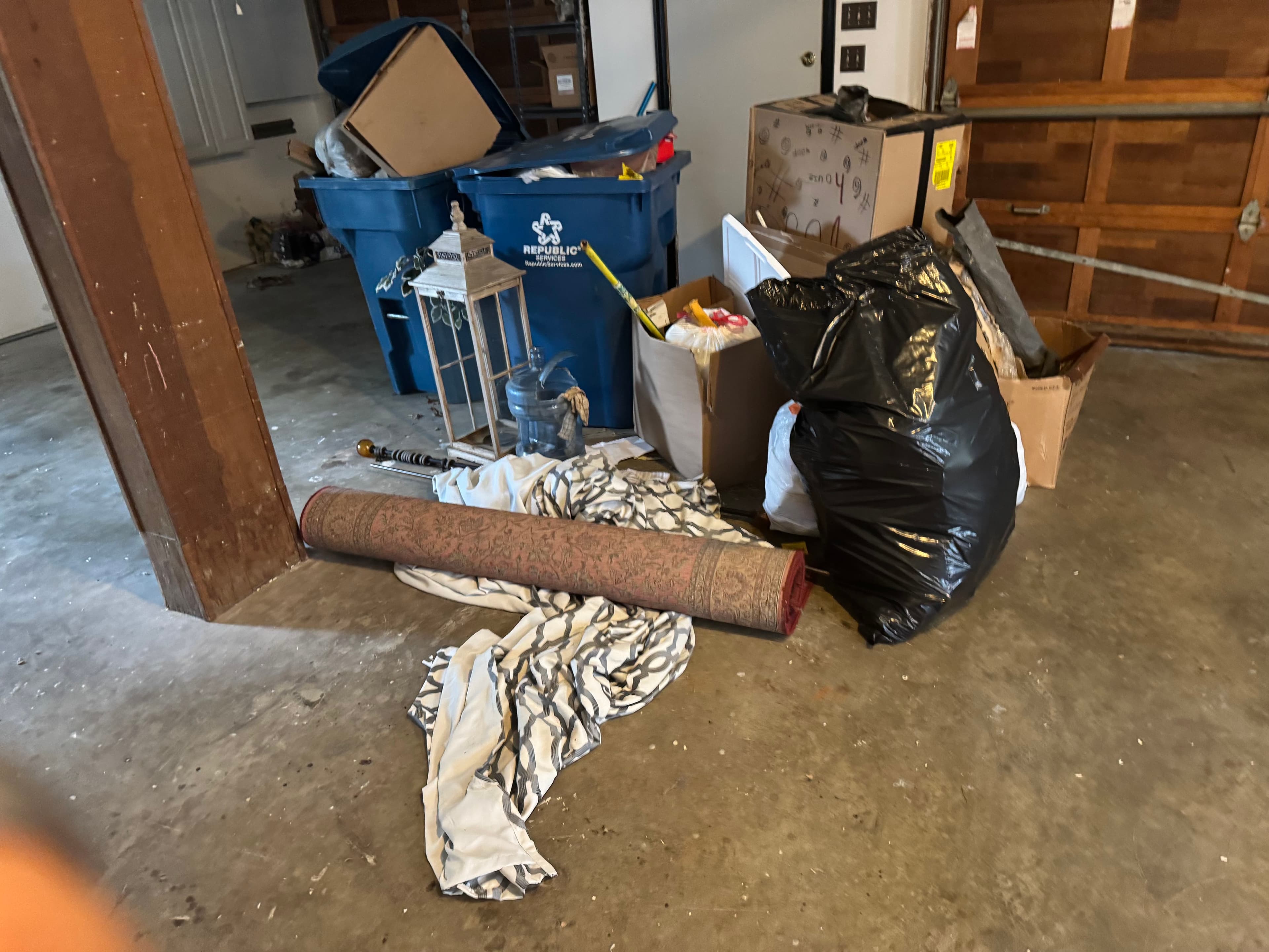 Garage filled with various items before cleanup